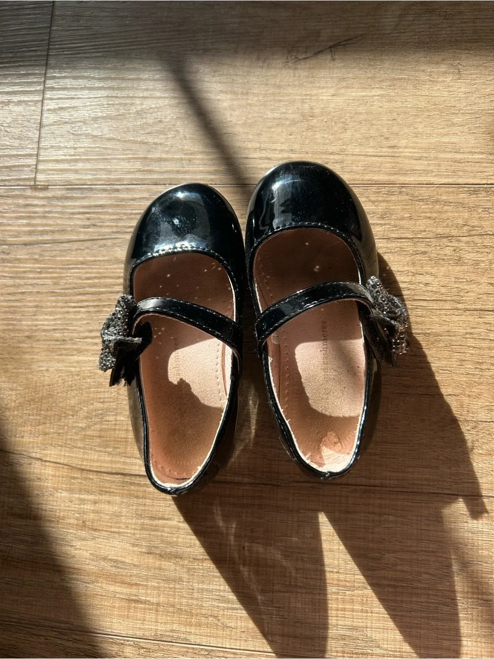 cupcakes & cashmere Black Patent Mary Jane Flats with Decorative Flower